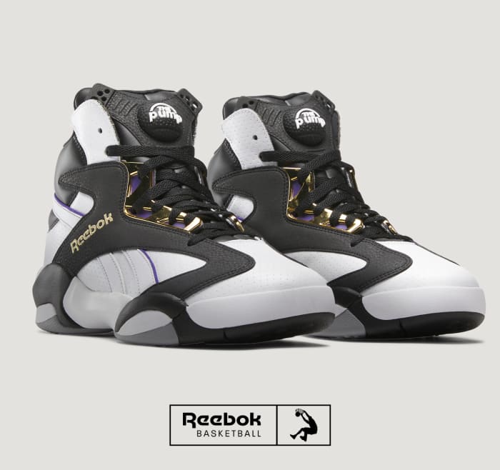 Side view of Shaquille O'Neal's black and white Reebok sneakers.